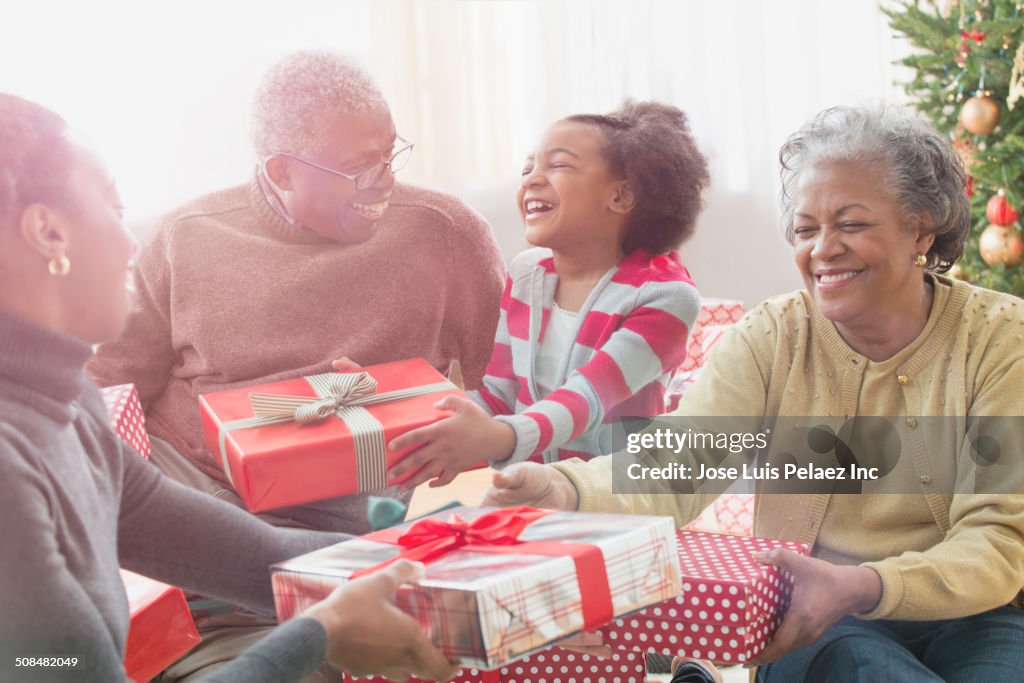Family opening Christmas presents together