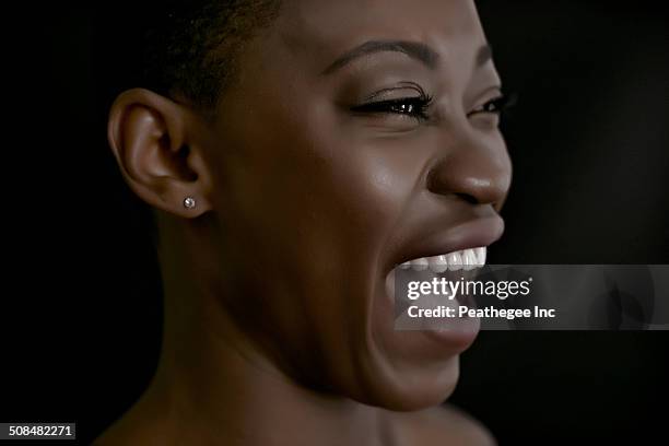 black woman laughing - mouth open profile stock pictures, royalty-free photos & images