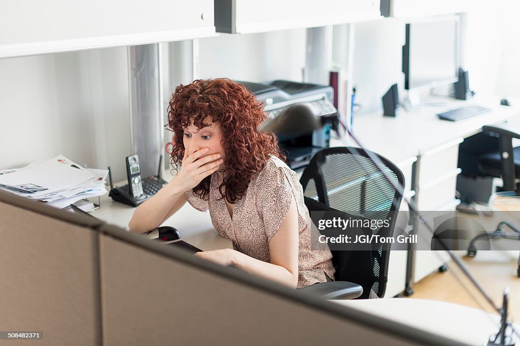 Hispanic businesswoman working in office