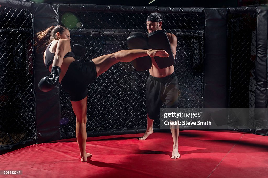 Caucasian fighters training in gym