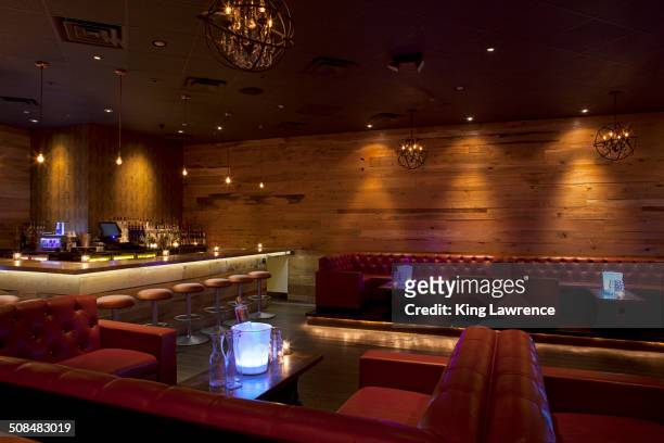 tables and booths in empty nightclub - ice bucket stock-fotos und bilder