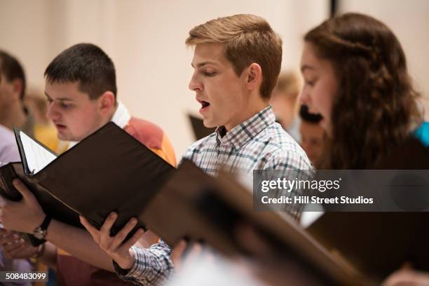 choir singing on stage - choir stage stock pictures, royalty-free photos & images