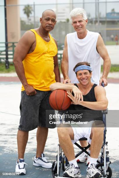 senior men smiling on basketball court - basketball all access stock pictures, royalty-free photos & images