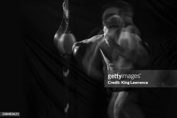 blurred view of caucasian boxer training - glory kickboxing stock-fotos und bilder
