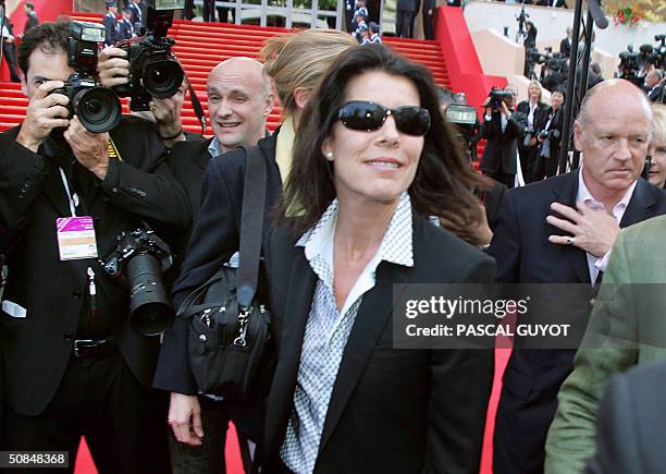 Princess Caroline of Monaco and her husband Prince Ernst August of Hanover leave the official screening of US film director Michael Moore's...