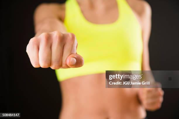 caucasian woman with bare stomach punching - beautiful bare women photos et images de collection