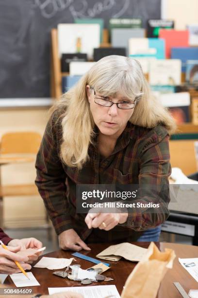 caucasian woman working in natural history museum - geology class stock pictures, royalty-free photos & images