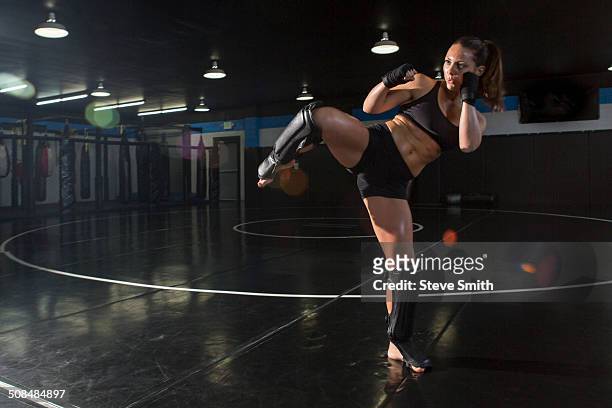 caucasian fighter training in gym - mixed martial arts stock-fotos und bilder