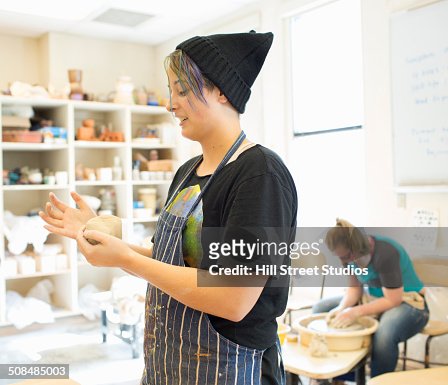 Student working in ceramics classroom