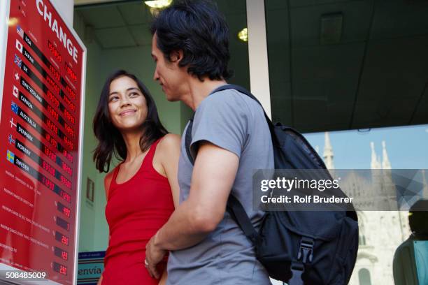 couple checking currency exchange rates - exchange rate bildbanksfoton och bilder