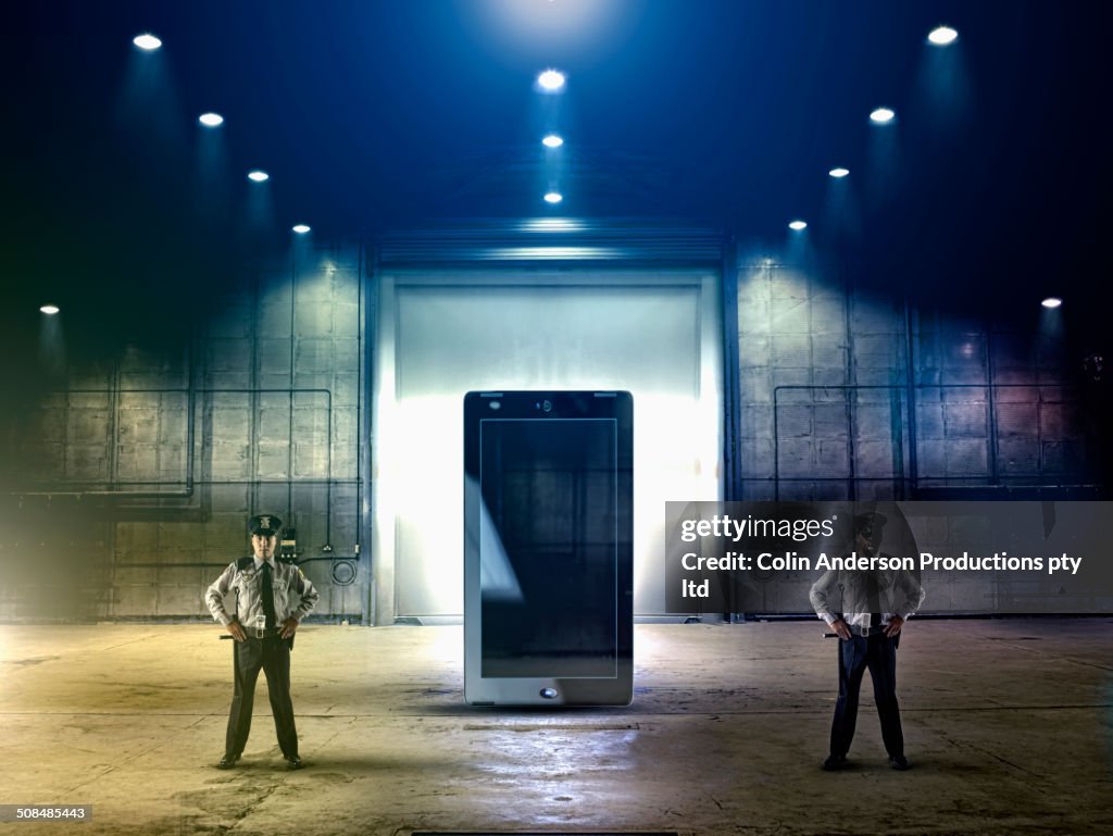 Security officers guarding tablet computer