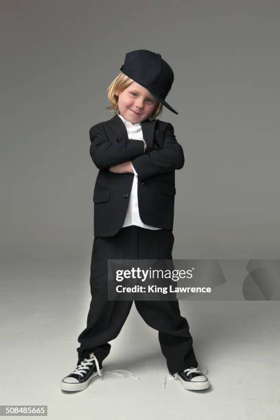 caucasian boy posing in oversized suit - kids fashion stockfoto's en -beelden