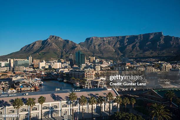 victoria and alfred waterfront, devil's peak and table mountain at the back, cape town, western cape, south africa - victoria and alfred waterfront cape town stock pictures, royalty-free photos & images