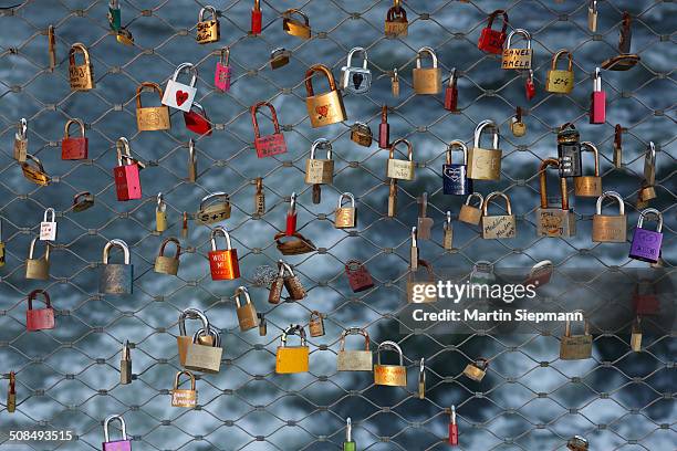 love locks, padlocks, as a sign of live, at the main bridge over the mur river, graz, styria, austria, europe - fond mur stock pictures, royalty-free photos & images