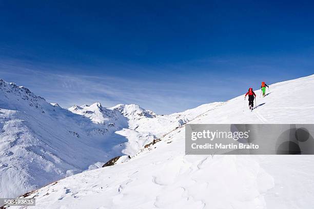 ski touring in the ascent to the kalfanwand in val martello, stelvio national park, province of south tyrol, italy - martell valley italy stock pictures, royalty-free photos & images