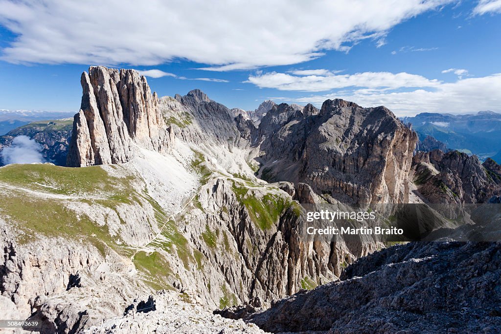 View during the ascent to the Croda Rossa in the Rose Garden Group over the Croda Rossa via ferrata, below the Vaiolonpass, behind the Tscheiner tips and the Rosengarten group with Kesselkogel, Dolomites, Province of South Tyrol, Italy