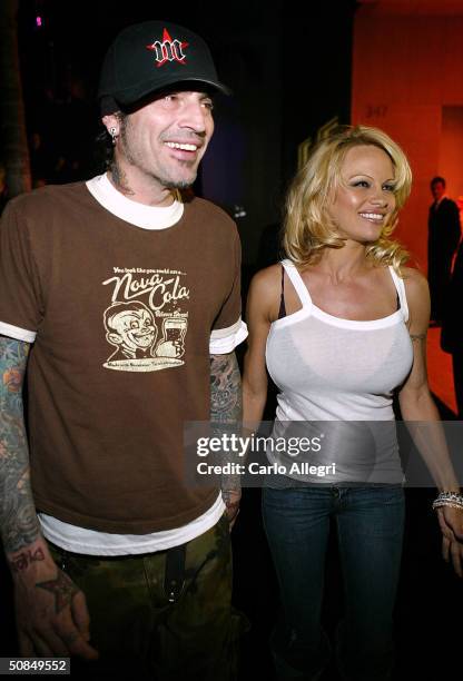 Musician Tommy Lee and actress Pamela Anderson leave the party at the 'Rodeo Walk of Style' Award on Rodeo Drive March 28, 2004 in Beverly Hills,...