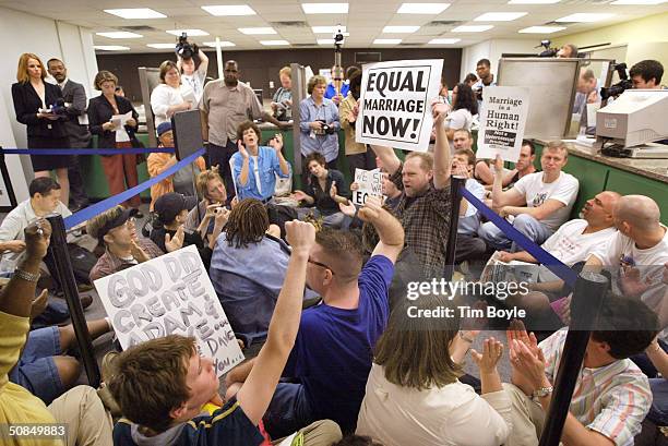 Demonstrators participate in a "sit-in" inside City Hall May 17, 2004 in Chicago, Illinois. Supporters and non-supporters of equal marriage rights...