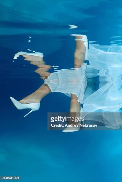 bride's feet, underwater wedding in pool - ideal wife stock pictures, royalty-free photos & images