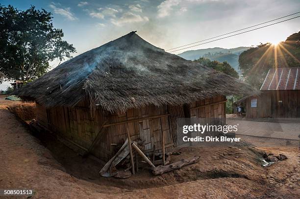 bamboo hut with smoke from cooking, village, northern thailand, thailand, asia - fumes cooking stock pictures, royalty-free photos & images