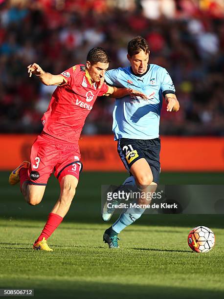 Iacopo La Rocca of Adelaide United competes for the ball with Filip Holosko of Sydney during the round 18 A-League match between Adelaide United and...