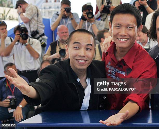 Thai director Apichatpong Weerasethakul and actor Sakda Kaewbuadee pose during a photo call for the film "Tropical Malady", 18 May 2004, at the 57th...