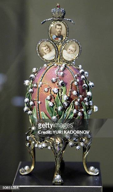 Faberge 1898 "Lilies of the Valley egg" displayed at an exhibition in the Kremlin in Moscow, 18 May 2004. A famed collection of nine Faberge imperial...