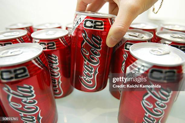 Cans of Coca-Cola C2 are seen May 18, 2004 in Tokyo, Japan. Coca-Cola announced that C2, will make a global premiere in Japan on June 7. C2 tastes...