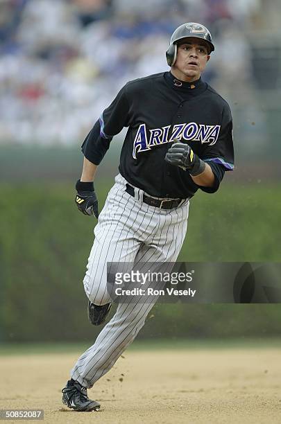Infielder Alex Cintron of the Arizona Diamondacks runs the baseline during the game against the Chicago Cubs at Wrigley Field on May 6, 2004 in...