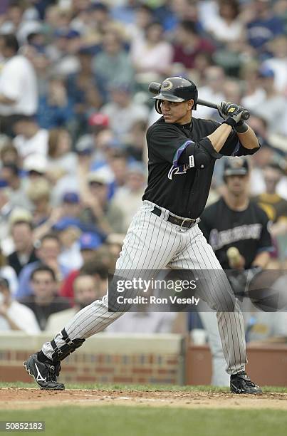 Infielder Alex Cintron of the Arizona Diamondacks attempts to hit a Chicago Cubs pitch during the game at Wrigley Field on May 6, 2004 in Chicago,...