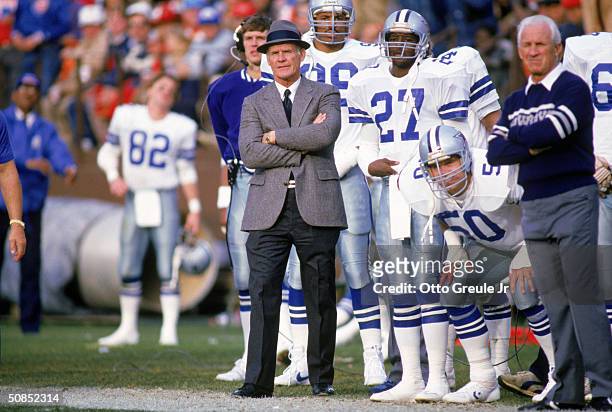 Head coach Tom Landry of the Dallas Cowboys watches from the sideline during a game in the 1988 season. Tom Landry coached the Cowboys from 1960 to...