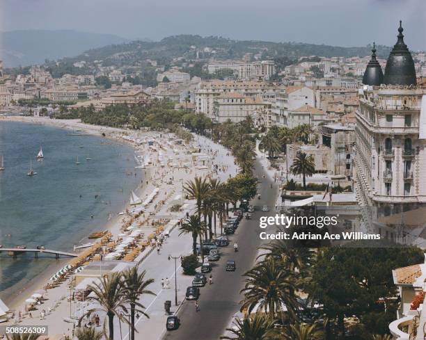 The Boulevard de la Croisette in Cannes, on the French Riviera, with the InterContinental Carlton Cannes on the right, circa 1955.
