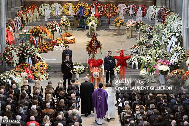 People pay tribute to Swiss French chef Benoit Violier during his funeral ceremony at the Cathedral of Lausanne, western Switzerland, on February 5,...