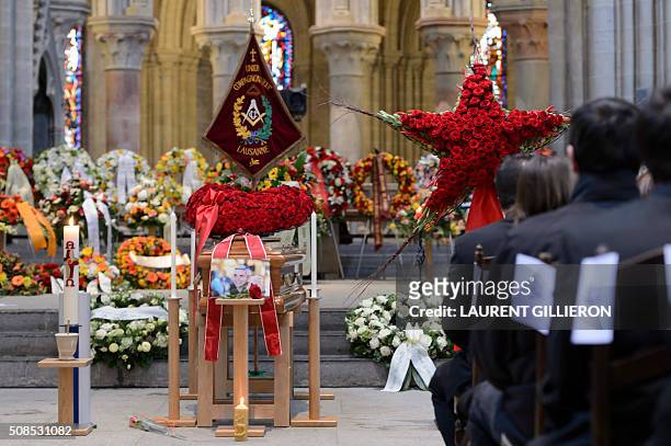 People pay tribute to Swiss French chef Benoit Violier during his funeral ceremony at the Cathedral of Lausanne, western Switzerland, on February 5,...