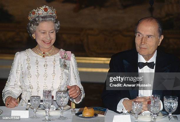 Queen Elizabeth II, wearing the Queen Burmese Ruby Tiara, attends a banquet with President Mitterrand on June 09, 1992 in Paris, France.