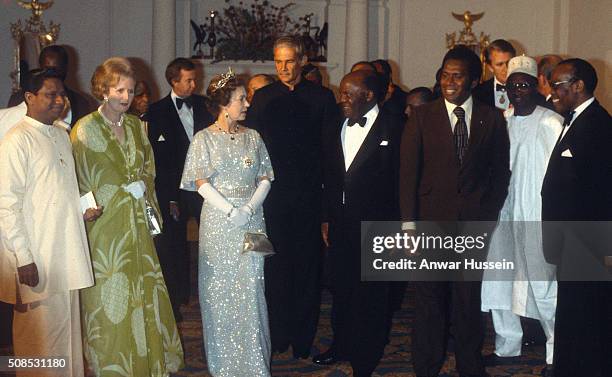 Queen Elizabeth II and Prime Minister Margaret Thatcher attend a ball to celebrate the Commonwealth Heads of Government Conference hosted by...