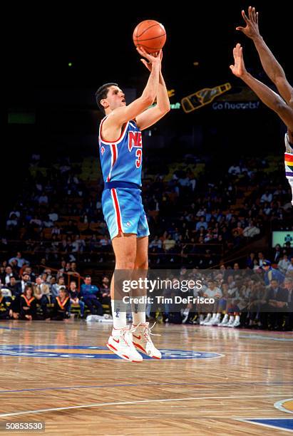 Drazen Petrovic of the New Jersey Nets shoots a jumper against the Denver Nuggets during a 1990-91 season game at McNichols Arena in Denver,...