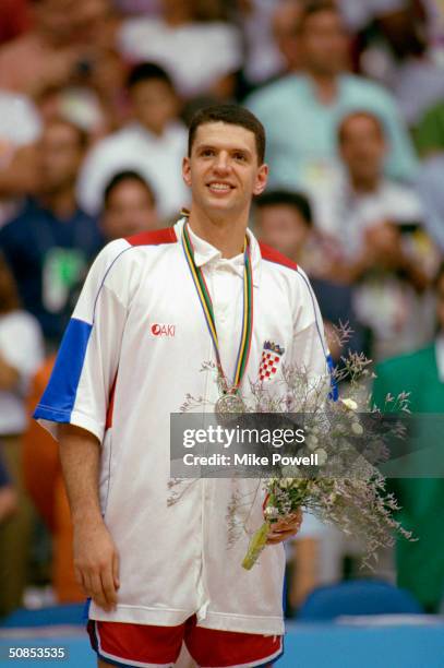 Drazen Petrovic of Croatia is awarded with the silver medal after the game against the United States in the 1992 Olympic games on August 8, 1992 in...