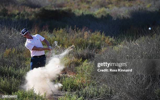 Kristoffer Broberg of Sweden plays out of trouble on the 17th hole during the second round of the Omega Dubai Desert Classic at the Emirates Golf...