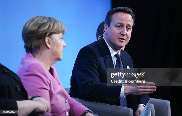 Angela Merkel, Germany's chancellor, left, listens to David Cameron, U.K. Prime minister, during a news conference at the Supporting Syria 2016...