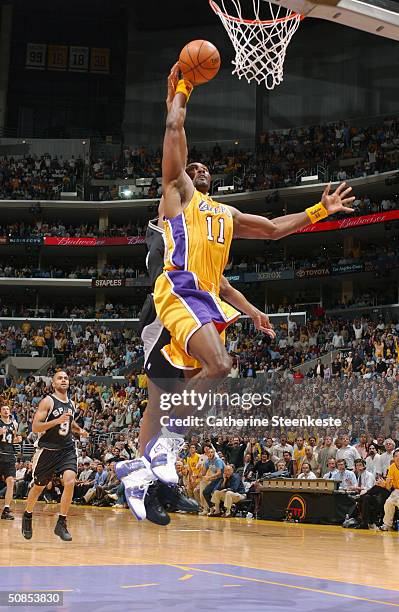 Karl Malone of the Los Angeles Lakers goes up for the slam dunk against the San Antonio Spurs in Game Four of the Western Conference Quarterfinals...