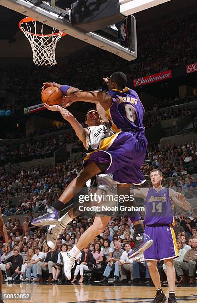 Emanuel Ginobili of the San Antonio Spurs shoots against Kobe Bryant of the Los Angeles Lakers in Game five of the Western Conference Semifinals...