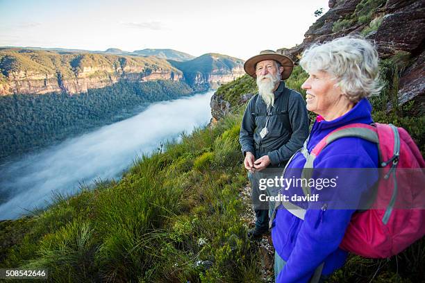 senior couple looking at view while bushwalking in australia - blue mountains australia stock pictures, royalty-free photos & images