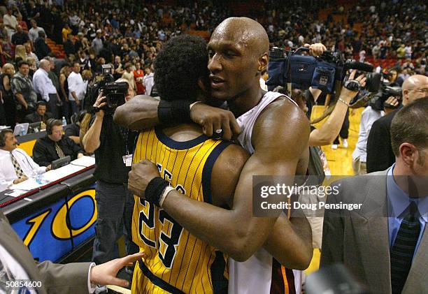 Lamar Odom of the Miami Heat congratulates Ron Artest of the Indiana Pacers with a hug following game 6 of the Eastern Conference Semifinals during...