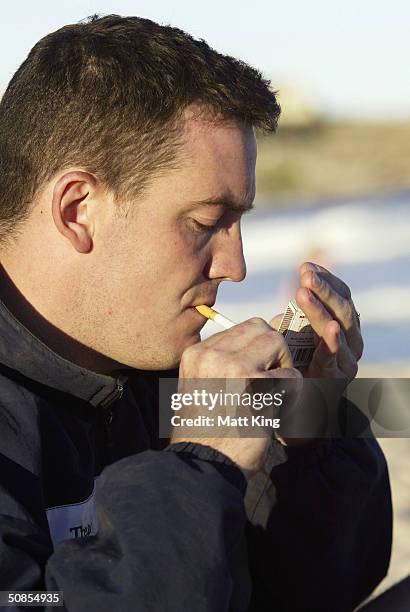Smoker lights a cigarette on Bondi Beach May 19, 2004 in Sydney, Australia. Waverley Council has passed a motion to investigate the legalities and...