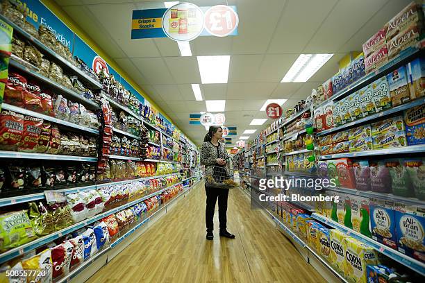 Customer browses breakfast cereal products at a Poundland Group Plc store in Leigh, U.K., on Thursday, Feb. 4, 2016. U.K. Like for like sales at...