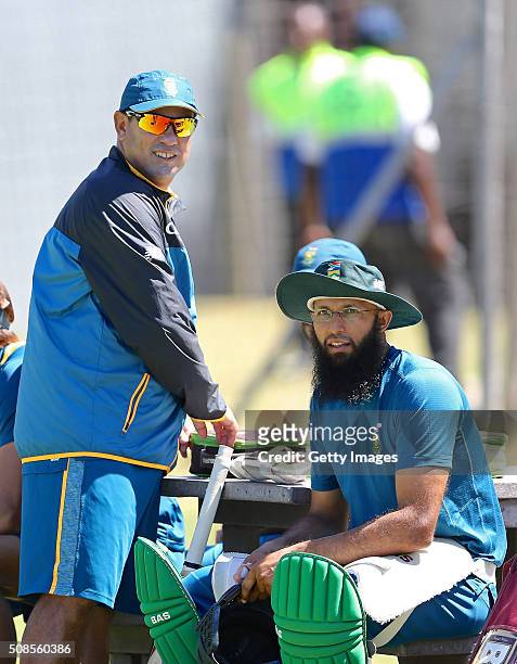 Coach Russell Domingo and Hashim Amla of South Africa look on during the Proteas training session and press conference at St Georges Park on February...