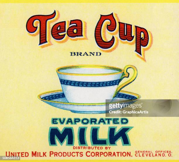 Vintage 'Tea Cup Brand Evaporated Milk' label with a teacup and saucer on a yellow background, color lithograph, c. 1910.