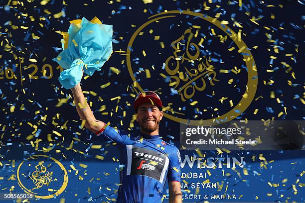 Giacomo Nizzolo of Italy and Trek Segafredo overall race leader and wearer of the blue jersey at the podium presentations following the Westin Stage...