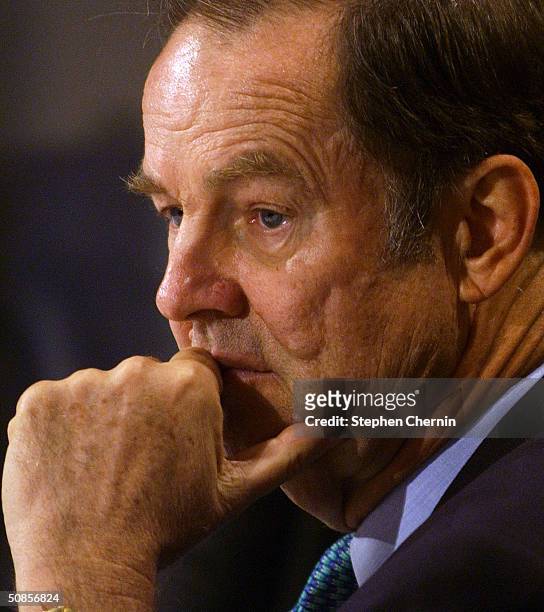 Tom Kean head of the 9-11 Commission listens to testimony during the second day of testimony at the 9-11 Commission May 19, 2004 in New York City....